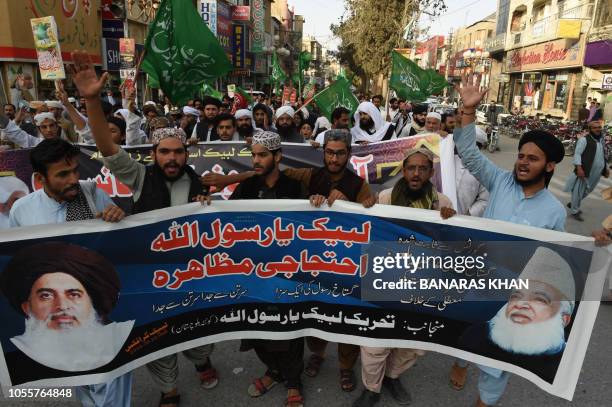 Supporters of the Tehreek-e-Labaik Pakistan , a hardline religious political party, chant slogans during a protest in Quetta on October 31 following...