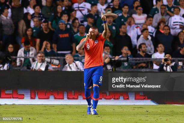 Nicolas Castillo of Chile celebrates after scoring the first goal of his team during the international friendly match between Mexico and Chile at La...
