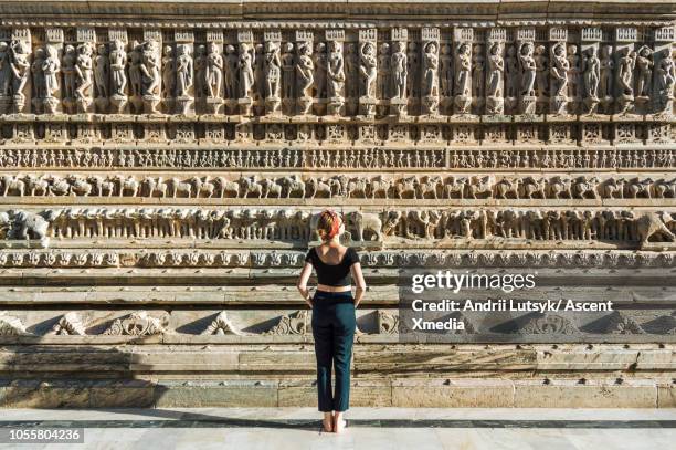 young woman explores jagdish temple - udaipur india stock pictures, royalty-free photos & images