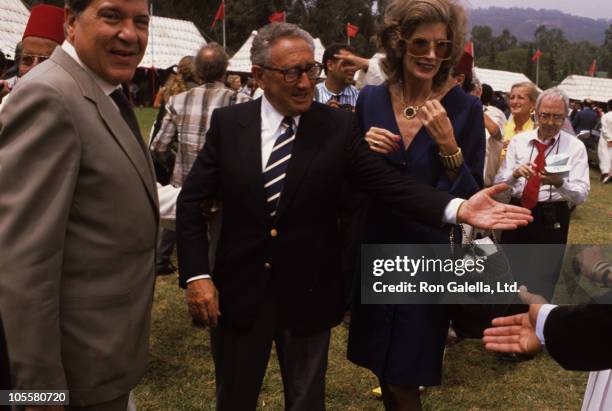 Guest, Henry Kissinger, and Nancy Kissinger during Malcolm Forbes' 70th Birthday Party, 1989 at Tangier Country Club in Tangier, Morocco.