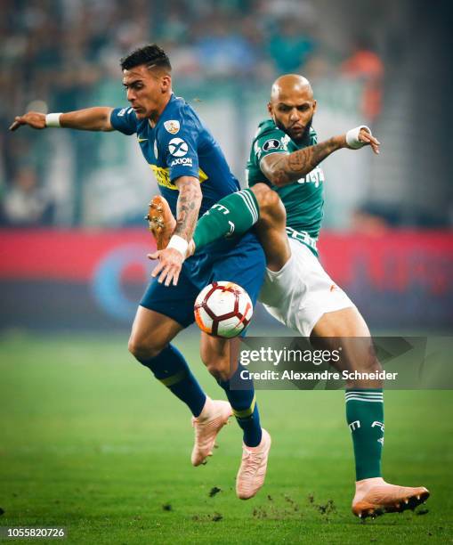 Cristian Pavon of Boca Juniors and Felipe Melo of Palmeiras compete for the ball during the match for the Copa CONMEBOL Libertadores 2018 at Allianz...