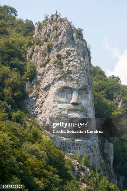 decebal head sculpted in rock, history, dubova, romania - romania mountain stock pictures, royalty-free photos & images