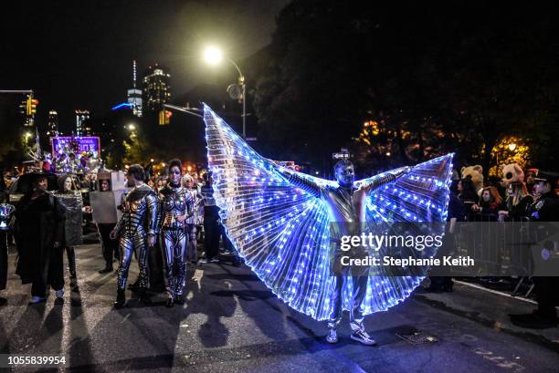 People in costumes participate in the annual Village Halloween parade on Sixth Avenue on October 31, 2018 in New York City.