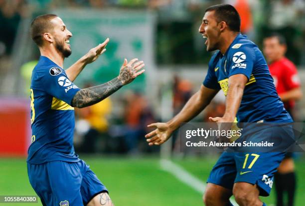 Dario Benedetto of Boca Juniors celebrates with teammate Ramon Abila after scoring the second goal of his team during the match against Palmeiras for...