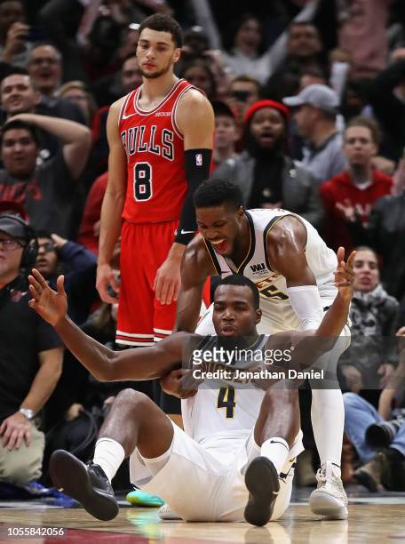 Paul Millsap and Malik Beasley of the Denver Nuggets celebrate after Millsap hit the game winning shot as Zach LaVine of the Chicago Bulls watches at...