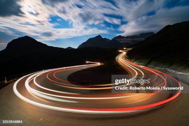 car lights, bernina pass, switzerland - car speeding imagens e fotografias de stock