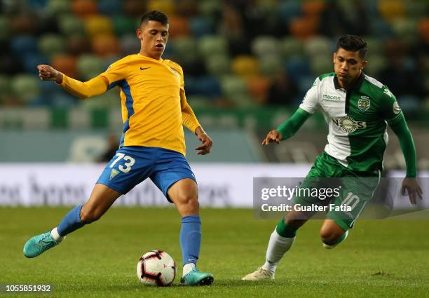 Matheus Luiz of GD Estoril Praia with Freddy Montero of Sporting CP in action during the Portuguese League Cup match between Sporting CP and GD...