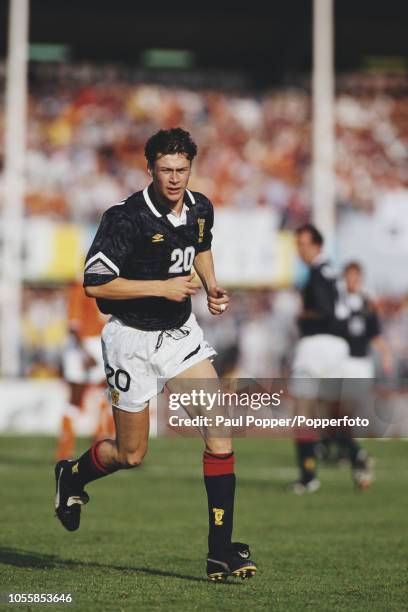 Scottish professional footballer Duncan Ferguson, forward with Dundee United FC, pictured in action playing for the Scotland national team in their...