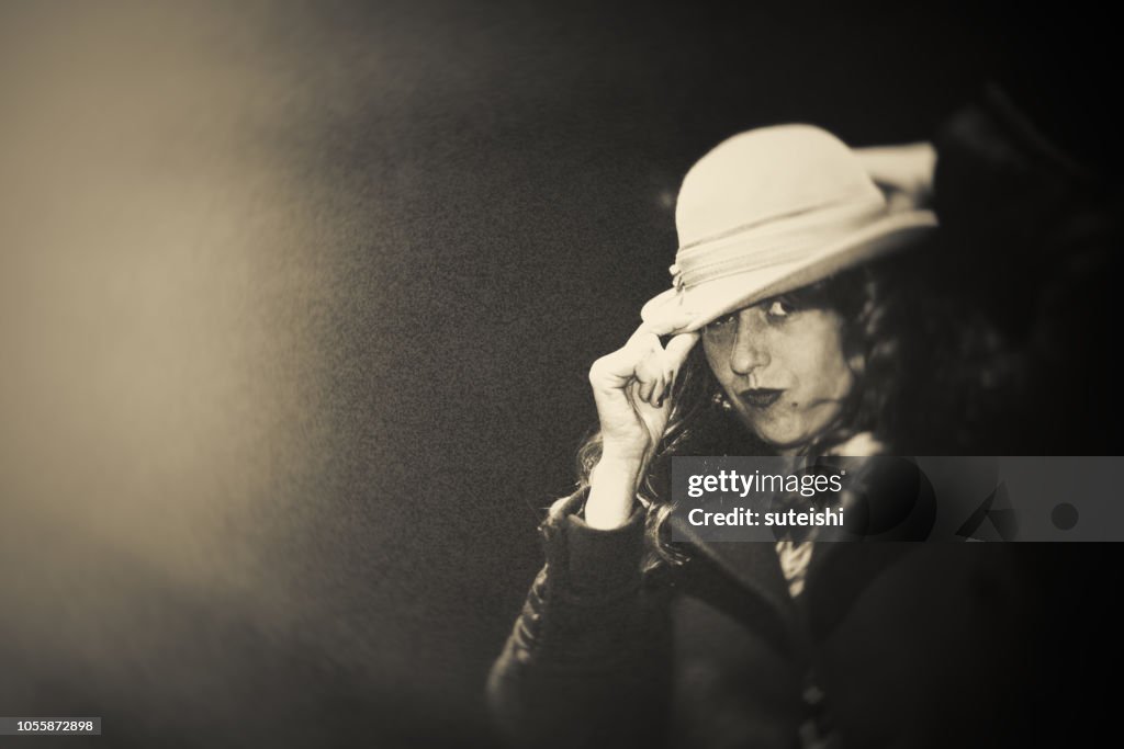 The beautiful woman with a hat.