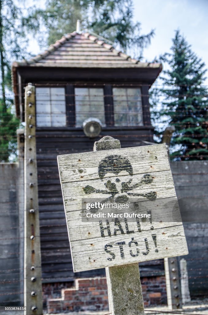 Watch tower with stop sign at the Auschwitz concentration camp in Poland during summer day