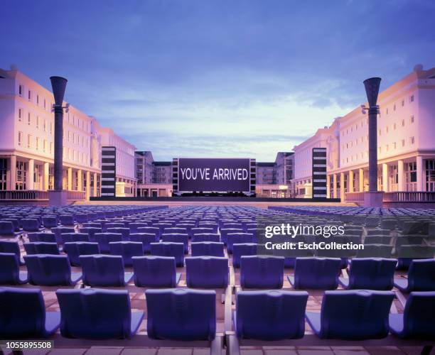 stage with screen and chairs at heart of town in france - open air kino stock-fotos und bilder