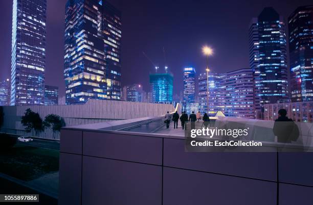 daily commute at modern business district at dusk - footbridge stock pictures, royalty-free photos & images