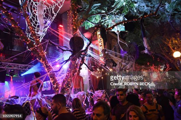 Party-goers show off their costumes at the annual West Hollywood Halloween Carnaval, billed as the world's largest Halloween party, October 31, 2018...