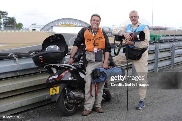 Allsport photographers Darrell Ingham and Pascal Rondeau wait near the Dunlop Bridge for the start of practice for 79th running of the FIA World...