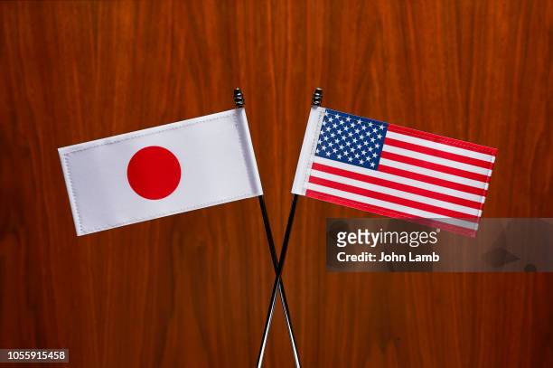 japanese and usa  flags. close-up. - diplomacy stock pictures, royalty-free photos & images