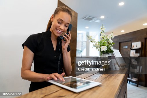 Woman working at a spa talking on the phone Woman working at a spa talking on the phone