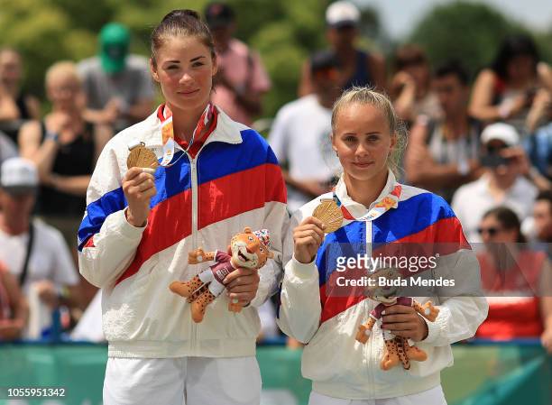Gold Medalists Mariia Bocharova and Maria Voronina of Russia pose in the podium of Women's Volleyball on day 11 of Buenos Aires 2018 Youth Olympic...