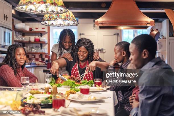 african-american preparing thanksgiving dinner - ethnic woman at christmas stock pictures, royalty-free photos & images