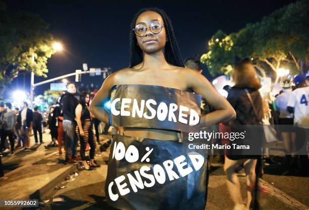 Mackenzie Palmer wears a 'censored' outfit in protest at the annual Hollywood Carnaval street party on October 31, 2018 in West Hollywood,...