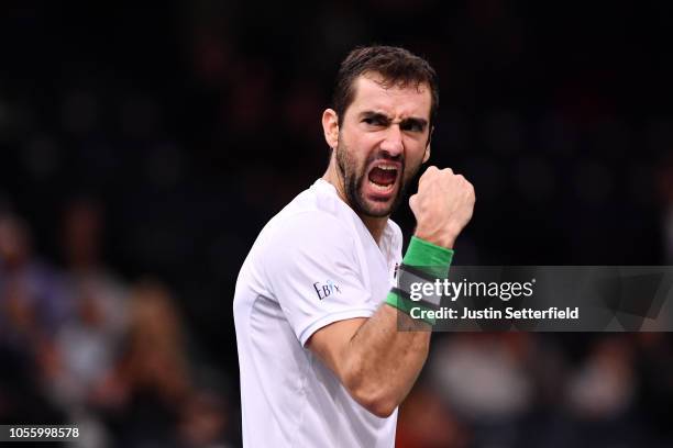 Marin Cilic of Croatia celebrates after winning match point in his Round of 16 match against Grigor Dimitrov of Bulgaria during Day Four of the Rolex...