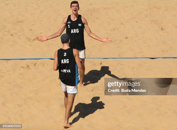 Mauro Zelayeta and Juan Bautista Amieva Tarditti of Argentina celebrate a point in Men's Volleyball Bronze Medal match during day 11 of Buenos Aires...