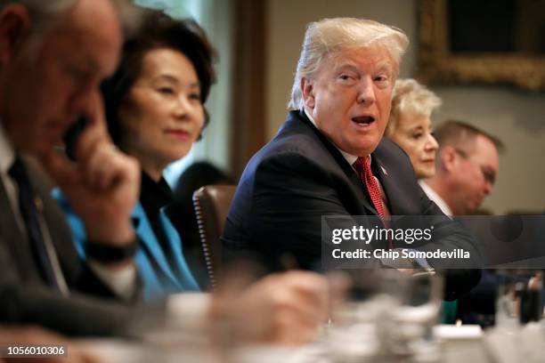 President Donald Trump conducts a meeting of his cabinet in the Cabinet Room at the White House October 17, 2018 in Washington, DC. Earlier this week...