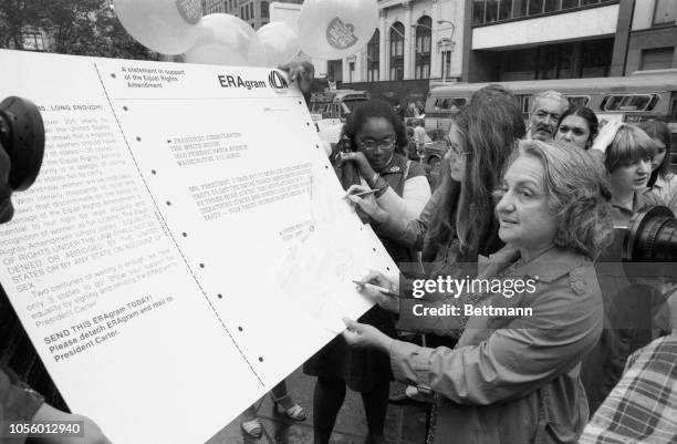 Feminist leaders Betty Friedan and Gloria Steinem , editor of MS magazine, sign telegrams asking President Carter to support the Equal Rights...