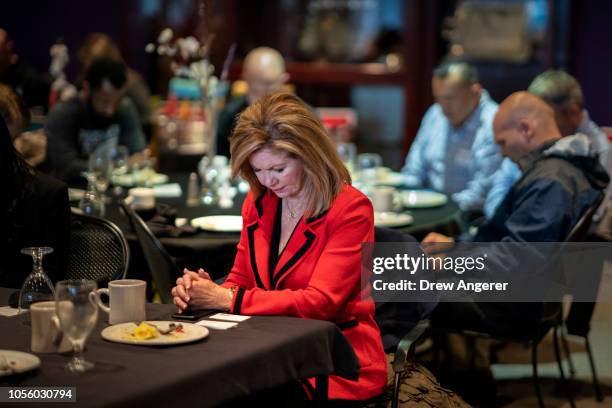 Rep. Marsha Blackburn , Republican candidate for U.S. Senate, bows her head in prayer during a breakfast event at The Looking Glass restaurant,...