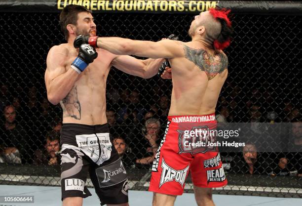 Carlos Condit of United States defeats Dan Hardy of Great Britain by knock out during their UFC welterweight bout at the O2 Arena on October 16, 2010...