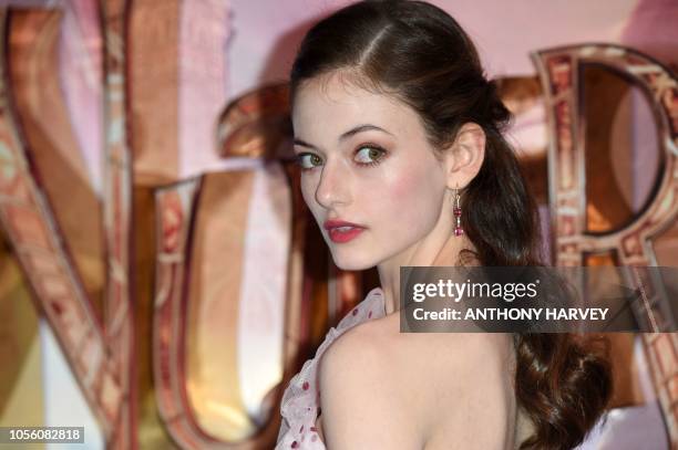 Actor Mackenzie Foy poses for a photograph as she arrives for the European premiere of the film 'The Nutcracker and the Four Realms' in London on...