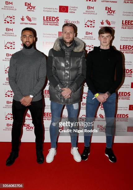 Leeds United players Kemar Roofe , Liam Cooper and Tom Pearce arrive for the Premier of Josh Warrington Fighting for a City at Leeds Town Hall on...