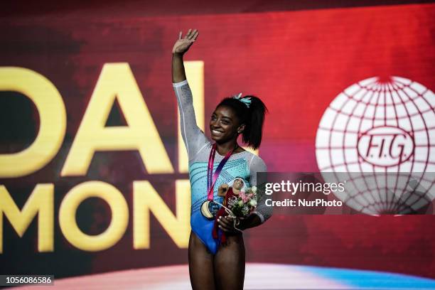 Simone Biles of United States with her goal medal at Individual Final for Women at the Aspire Dome in Doha, Qatar, Artistic FIG Gymnastics World...