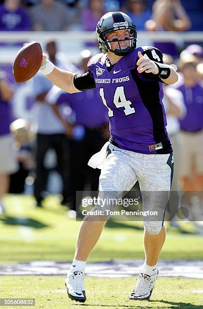 Quarterback Andy Dalton of the TCU Horned Frogs looks for a receiver against the BYU Cougars at Amon G. Carter Stadium on October 16, 2010 in Fort...