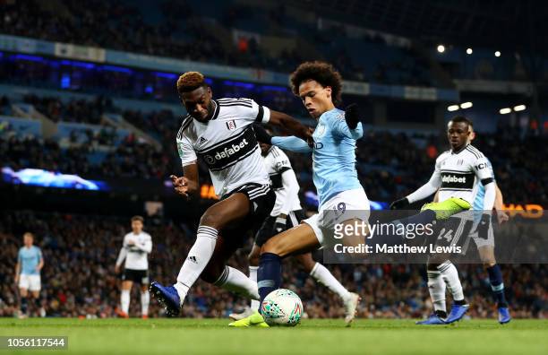 Leroy Sane of Manchester City is challenged by Timothy Fosu-Mensah of Fulham during the Carabao Cup Fourth Round match between Manchester City and...