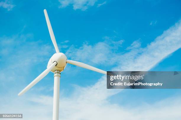 close up of wind turbine isolated on blue sky - wind power japan stock pictures, royalty-free photos & images