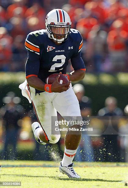 Quarterback Cam Newton of the Auburn Tigers runs with the ball during the game against the Arkansas Razorbacks at Jordan-Hare Stadium on October 16,...