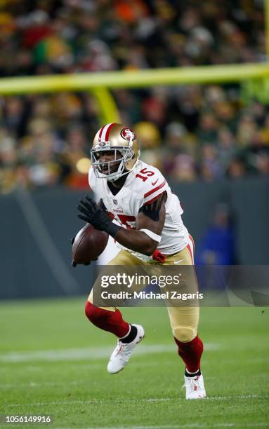 Pierre Garcon of the San Francisco 49ers runs after making a reception during the game against the Green Bay Packers at Lambeau Field on October 15,...