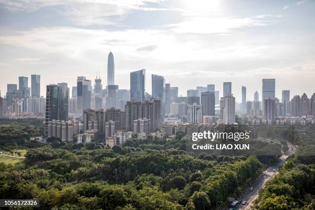 shenzhen skyline backlighting - shenzhen stock pictures, royalty-free photos & images