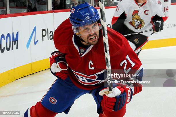 Brian Gionta of the Montreal Canadiens celebrates his first goal of the season during the NHL game against the Ottawa Senators on October 16, 2010 at...