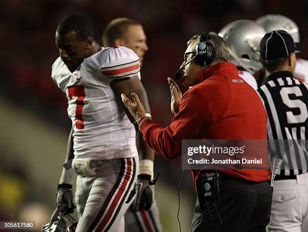 Head coach Jim Tressel of the Ohio State Buckeyes tries to encourage his team including Jermale Hines against the Wisconsin Badgers at Camp Randall...