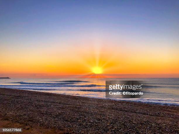 benicarló beach and sunset - romantic sky stock pictures, royalty-free photos & images