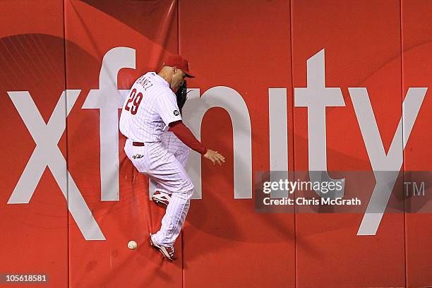 Raul Ibanez of the Philadelphia Phillies is unable to make a catch of a ball hit by Pat Burrell of the San Francisco Giants in the sixth inning to...