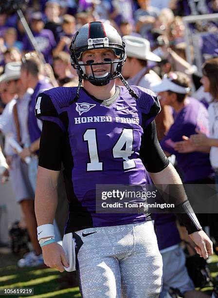 Quarterback Andy Dalton of the TCU Horned Frogs walks on the field against the BYU Cougars at Amon G. Carter Stadium on October 16, 2010 in Fort...