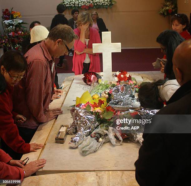 People gather by Mary MacKillops tomb in Sydney on October 16, 2010. Pope Benedict XVI will formally recognise Australia's first saint, Mary...