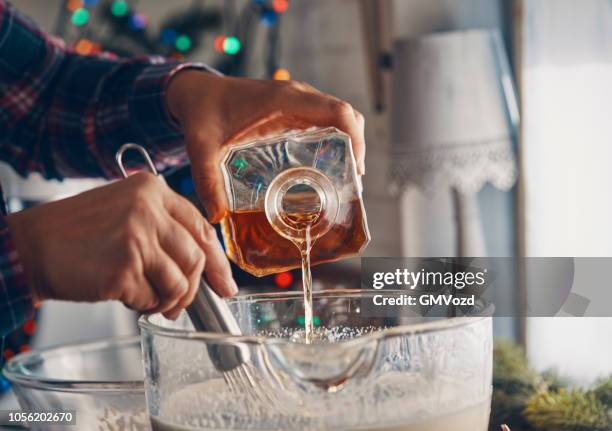 preparing eggnog for christmas - eggnog stock pictures, royalty-free photos & images