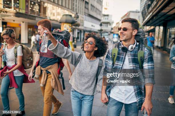 young backpackers in the city - young couple exploring city stock pictures, royalty-free photos & images