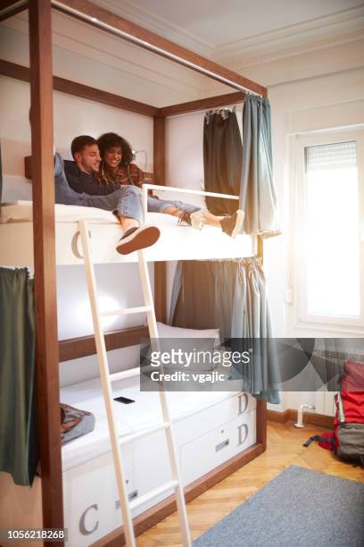friends in a hostel - hostel stock pictures, royalty-free photos & images