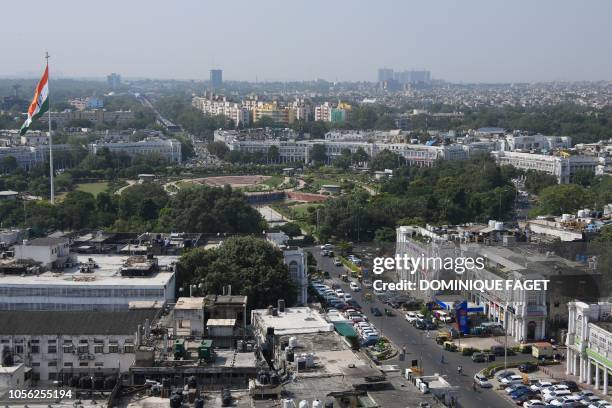 This picture taken on September 19 shows the Connaught Place commercial district in New Delhi. - Smog levels spike during winter in Delhi, when air...