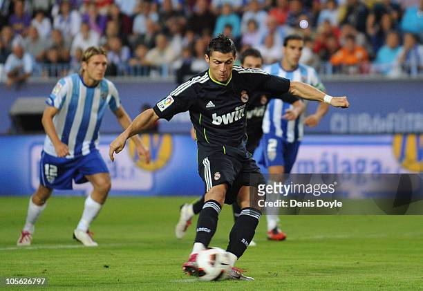 Cristiano Ronaldo of Real Madrid scores from a penatly kick during the La Liga match between Malaga and Real Madrid at La Rosaleda Stadium on October...