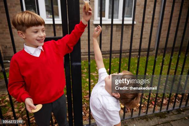 big brother teasing little brother - cruelity stock pictures, royalty-free photos & images